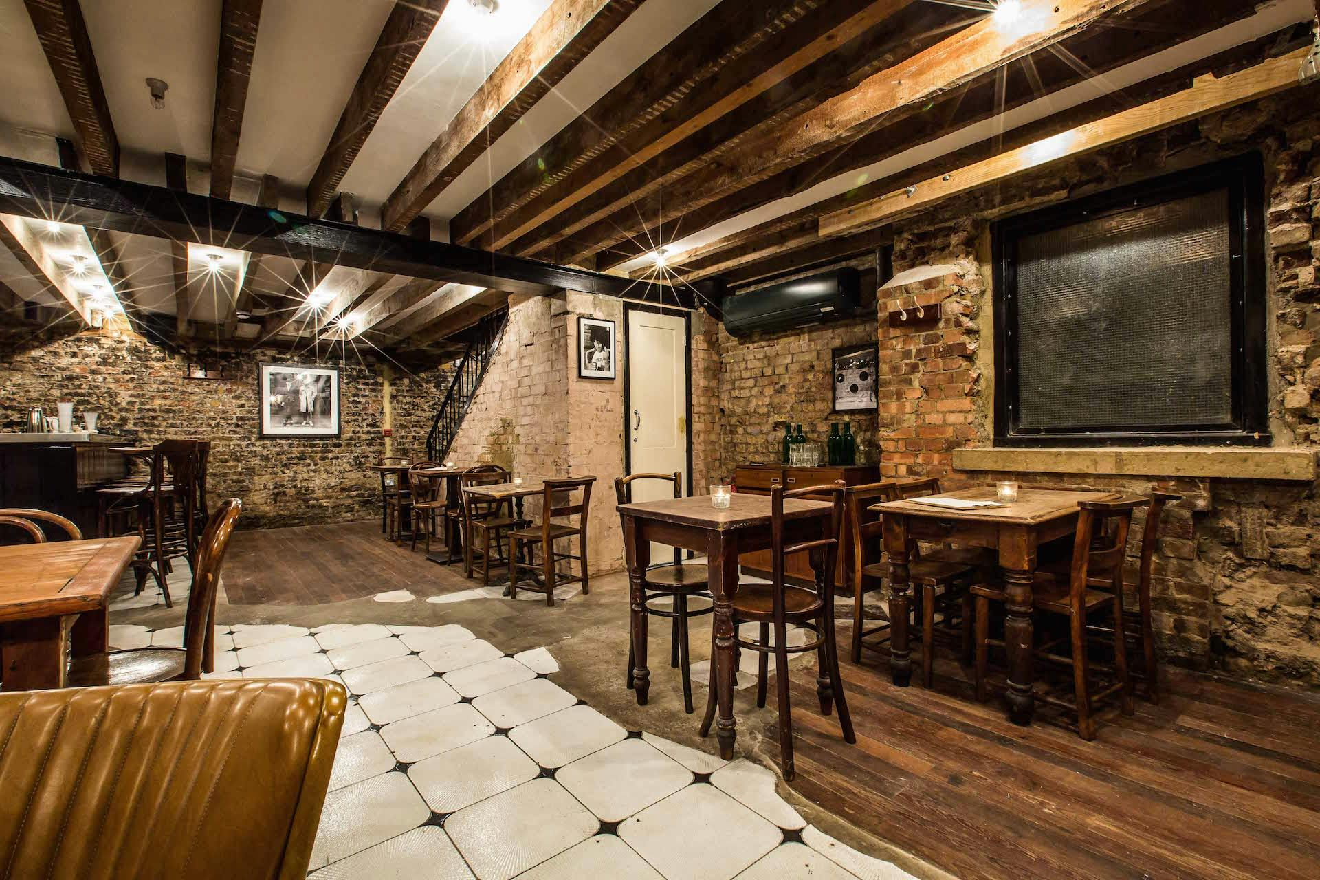 Rustic event space with exposed brick, ideal for networking events and workshops.