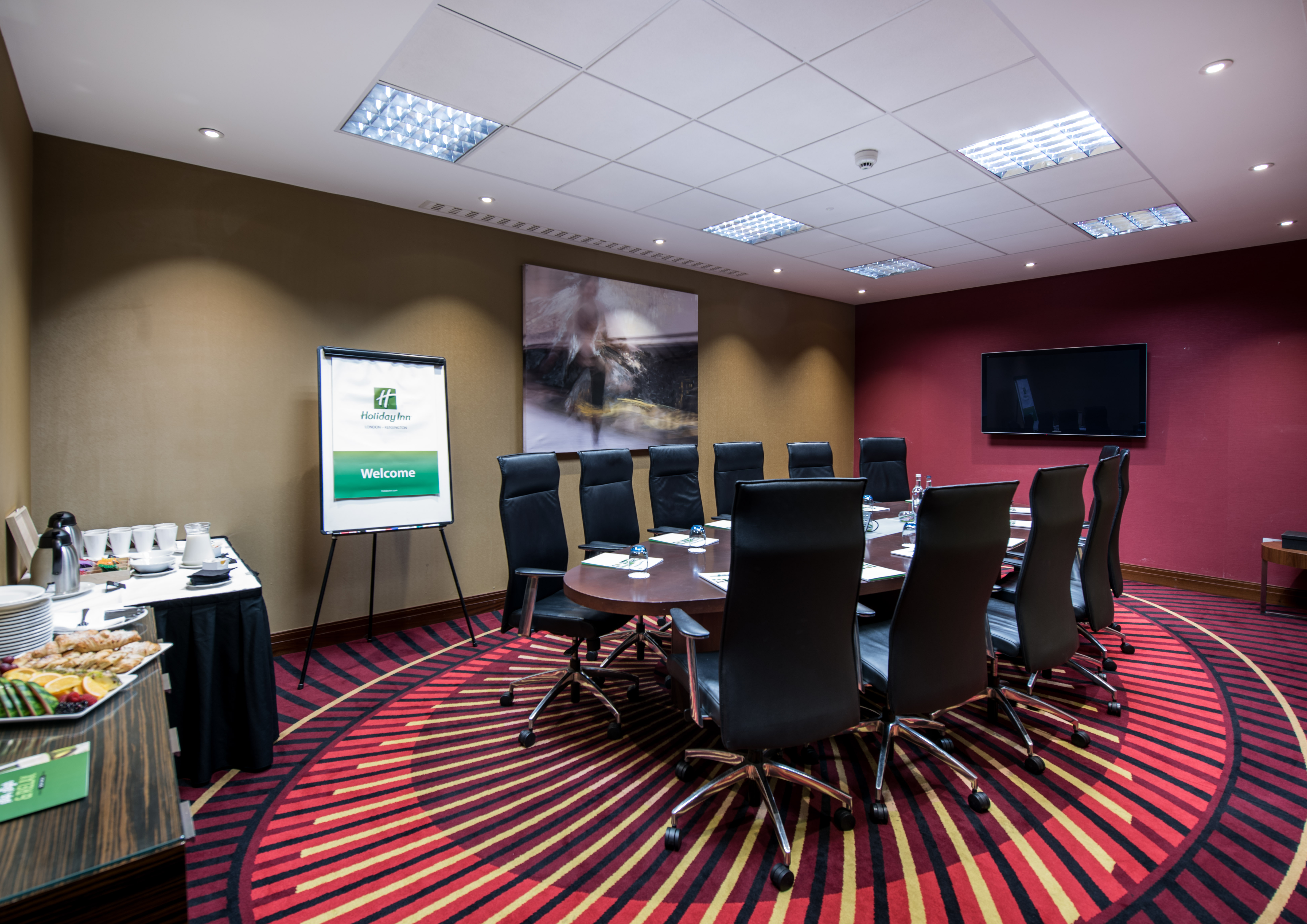 Executive Boardroom 1-3 at Holiday Inn London, round table setup for corporate meetings.