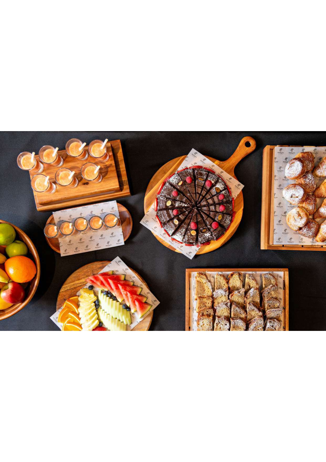 Executive Boardroom with elegant dessert platters for meetings at Holiday Inn Kensington.