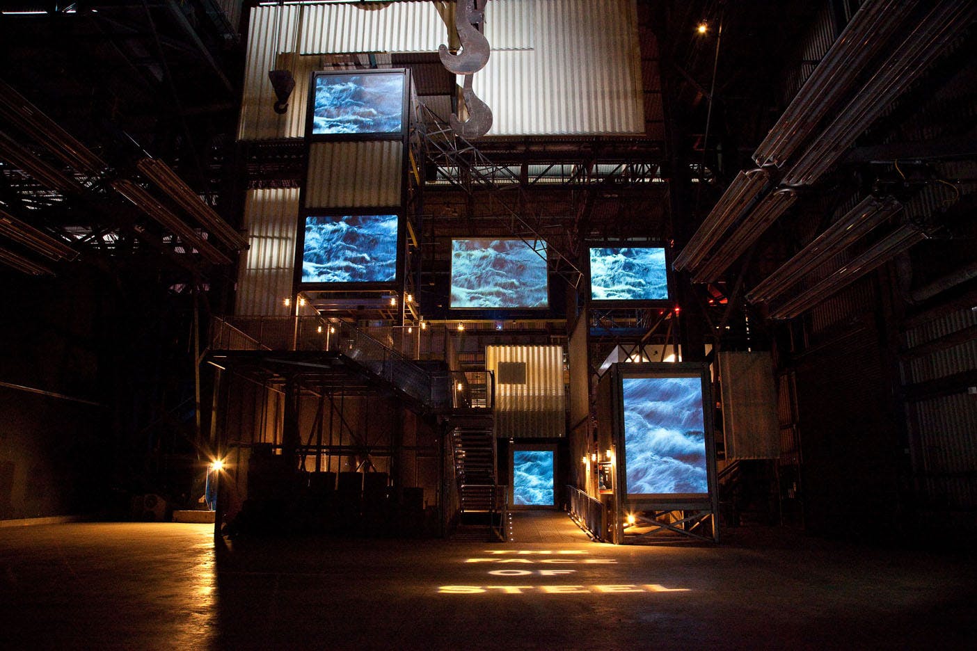 The Face of Steel venue with large screens for immersive corporate events and art showcases.