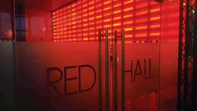Red Hall at MAGNA: modern event space with striking red lighting for dynamic gatherings.