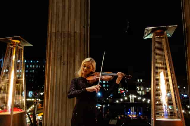 Violinist at National Gallery outdoor reception, VIP event