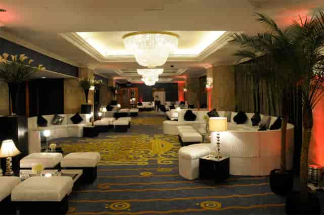 Grand Ballroom at London Hilton: elegant event space with plush seating for upscale gatherings.