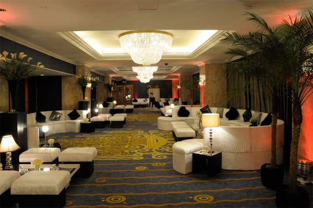 Grand Ballroom at London Hilton: elegant event space with plush seating for upscale gatherings.
