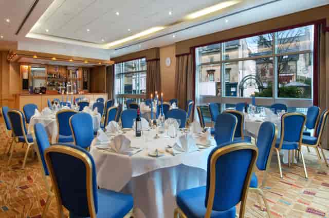 County Suite banquet room with floor-to-ceiling windows for corporate dinners or events.