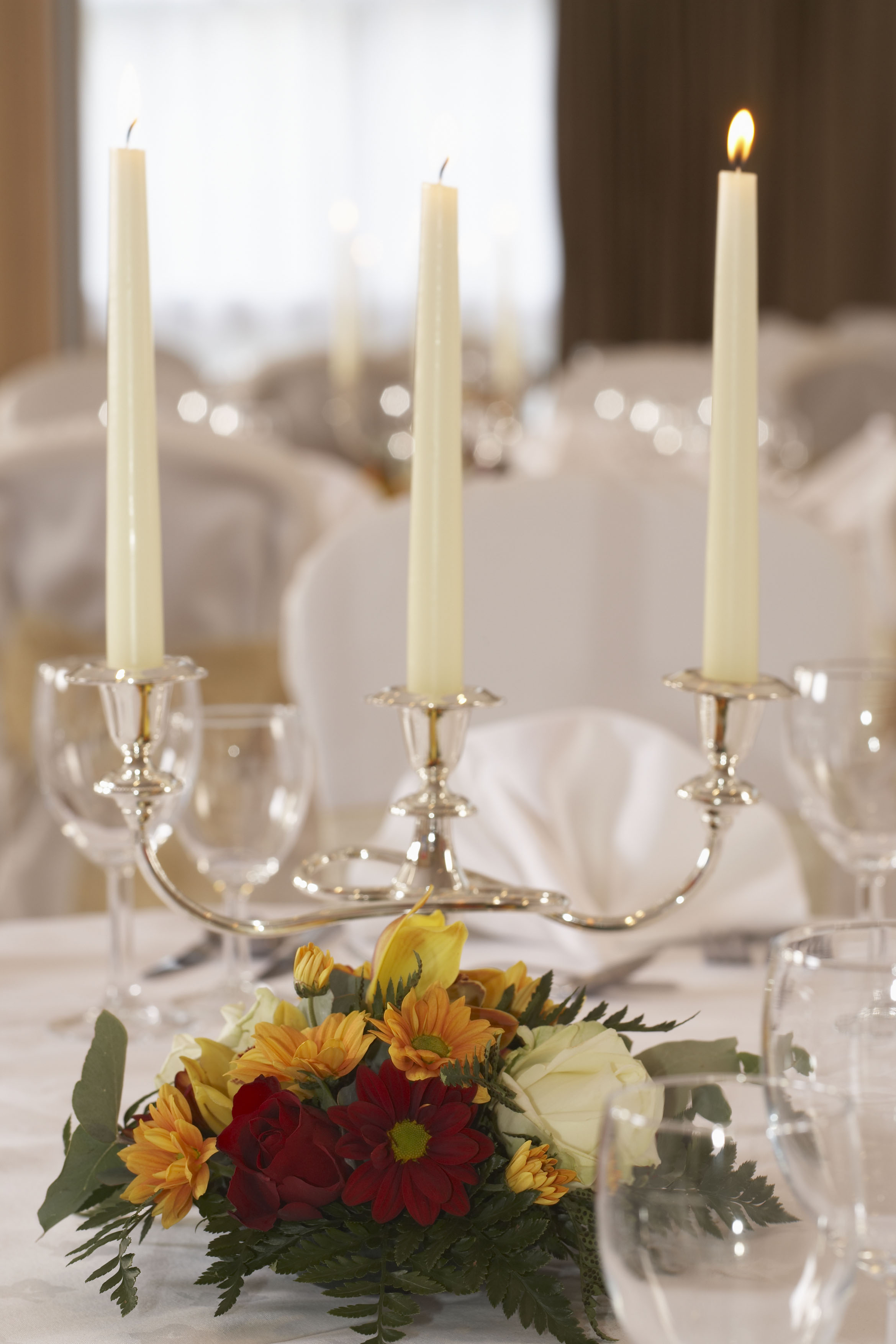 Silver candelabra centerpiece on formal linens at a Hilton Bath City gala or wedding reception.