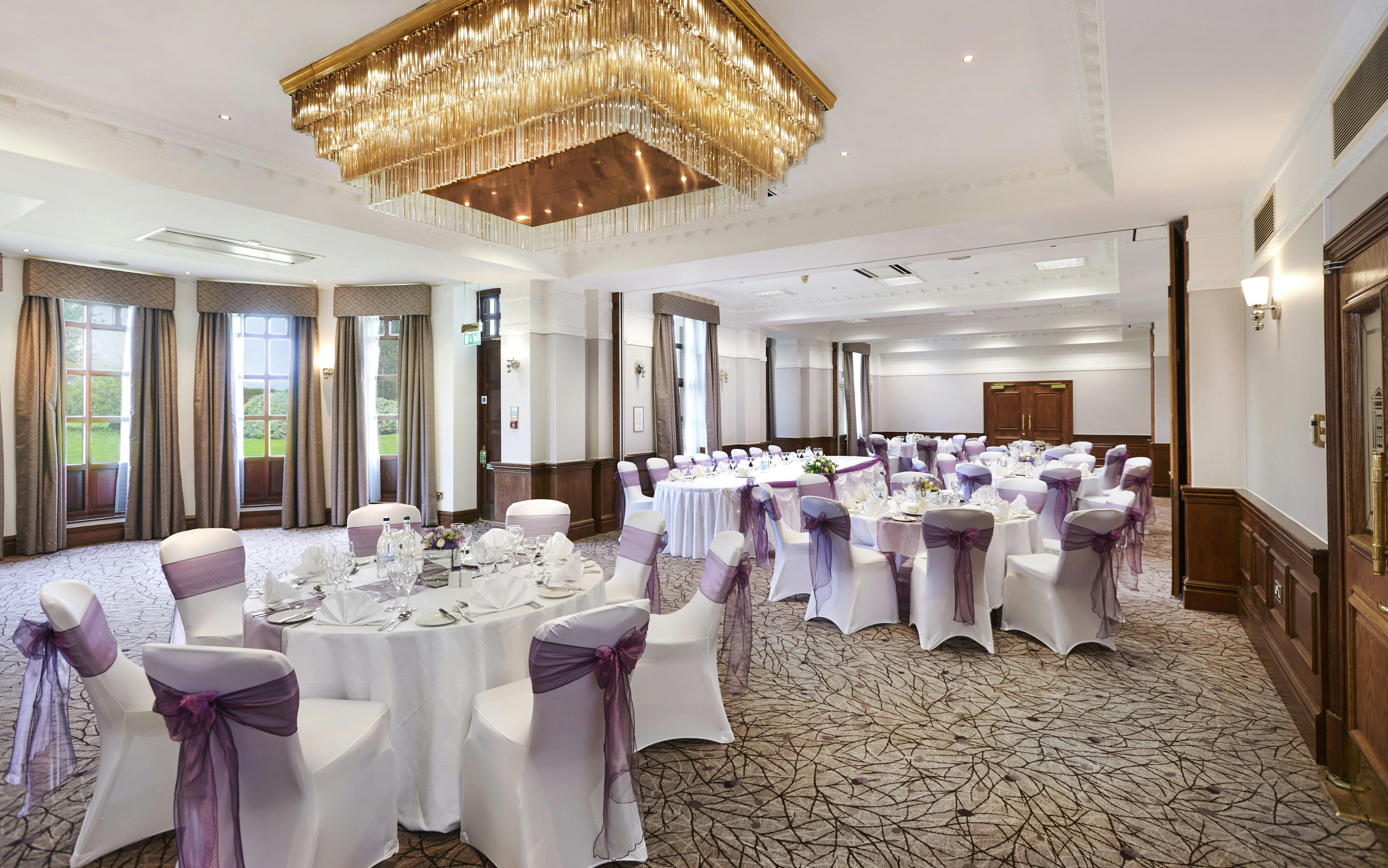 Elegant ballroom at Hilton Puckrup Hall, Tewkesbury, ideal for weddings and formal events.