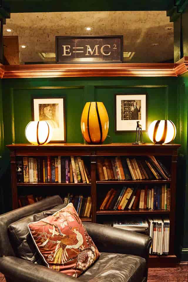 L'Escargot Library: Cozy wood, green walls, executive retreat, book club.