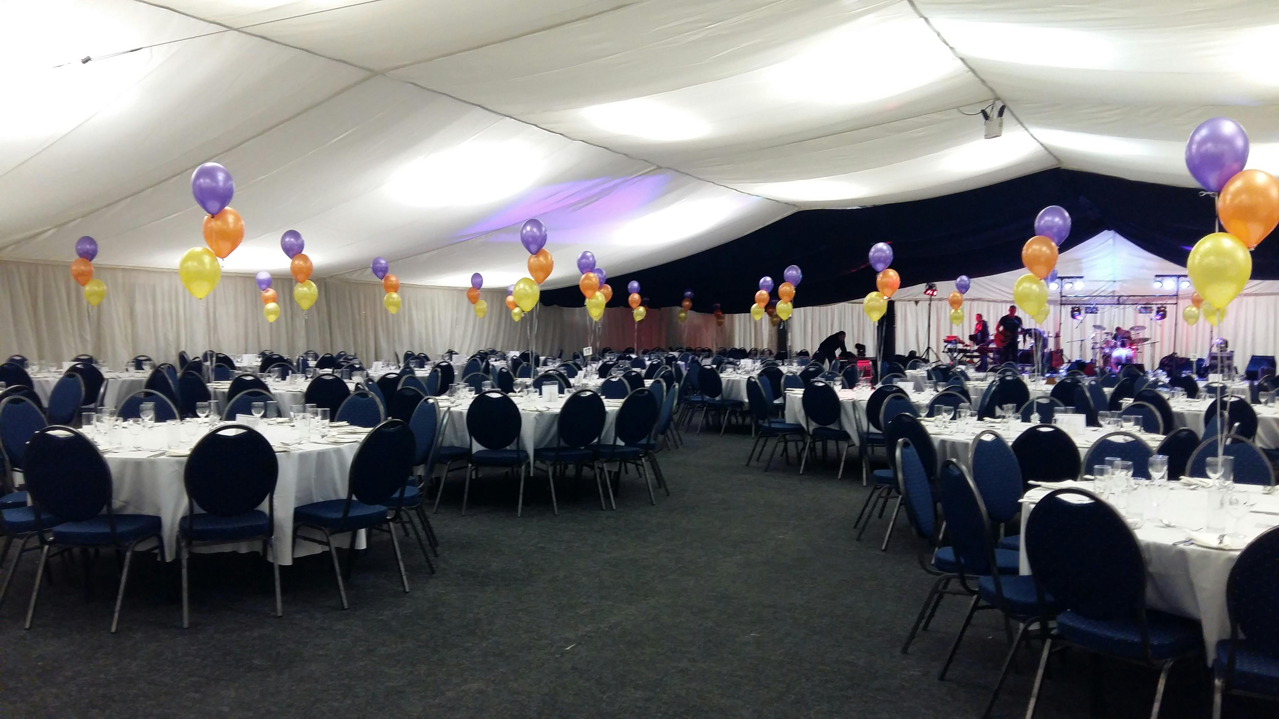 John Hendry Pavilion event space with round tables, balloons for celebrations and corporate events.