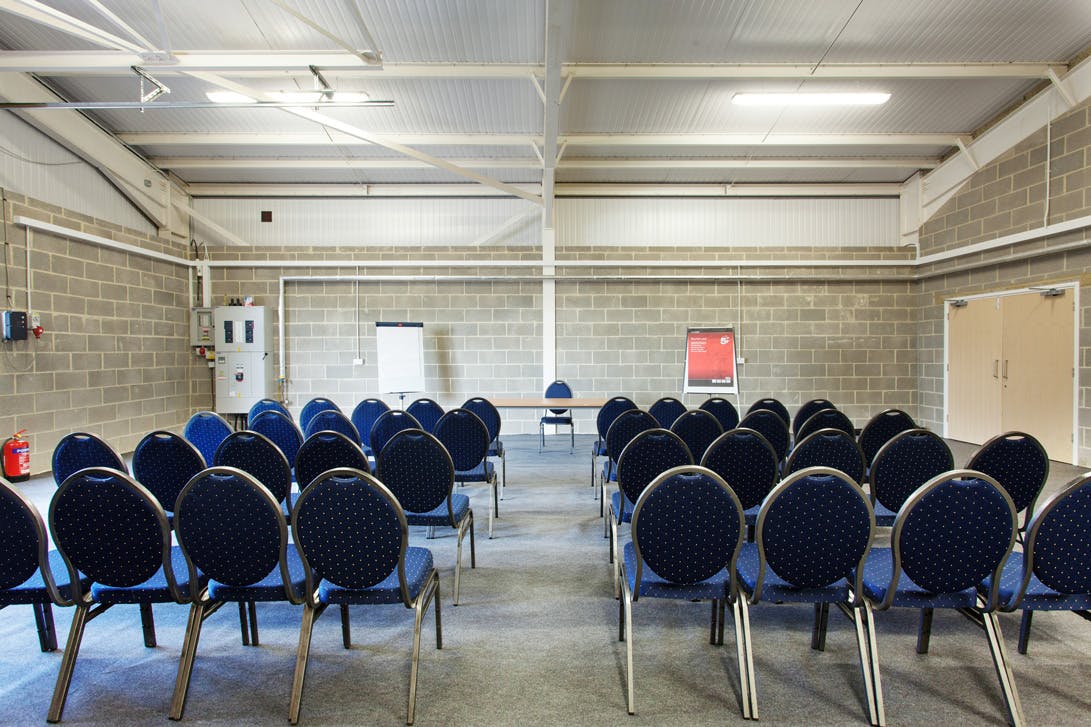 Cornwallis Room at Kent Event Centre set for a collaborative workshop with blue chairs.