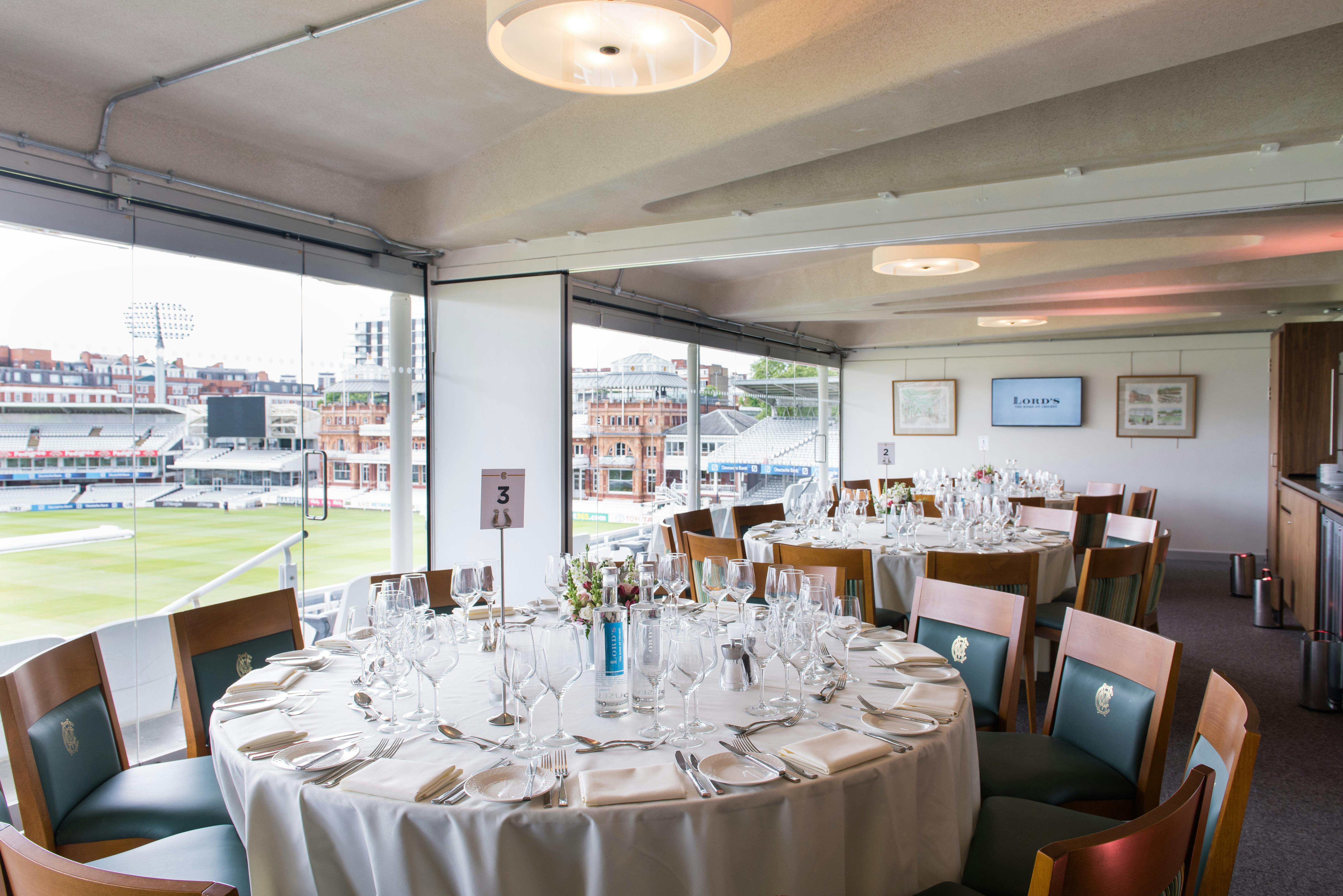 Elegant dining setup in The President's Box at Lord's Cricket Ground for corporate events.