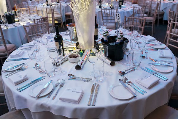 Elegant round table setup at Braxted Park for a sophisticated event.