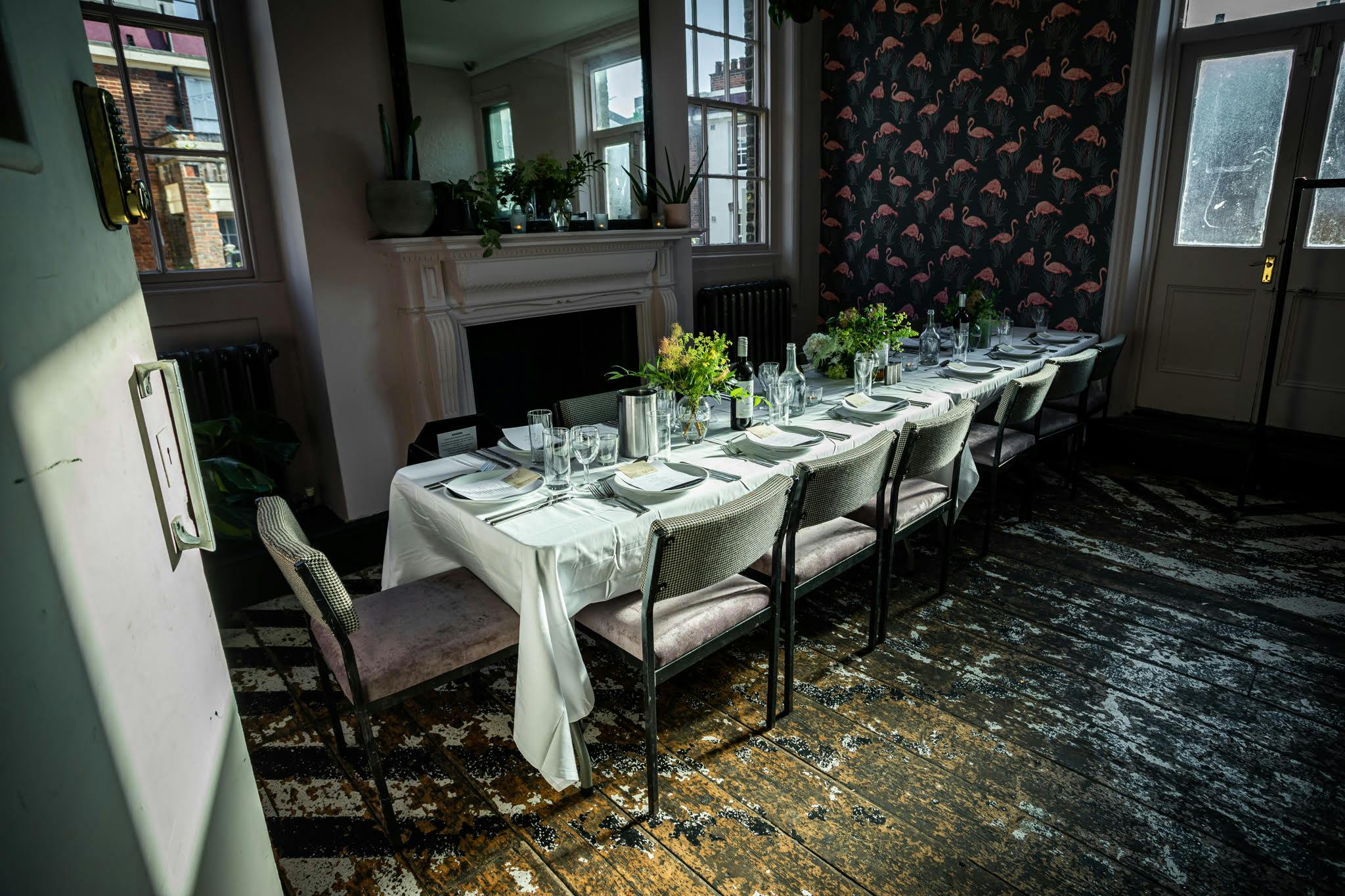 Elegant long dining table in The Sanctuary, perfect for private dinners and gatherings.
