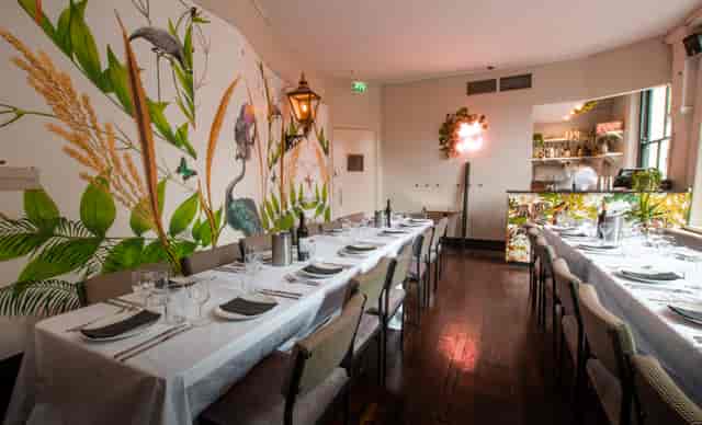 Elegant dining space at The Aviary, perfect for intimate meetings and events.