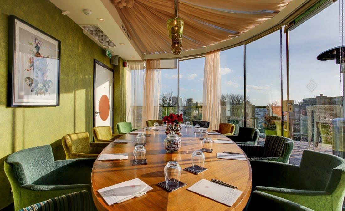 Private dining room with oval table, ideal for executive meetings at Grand Palace Seafood.