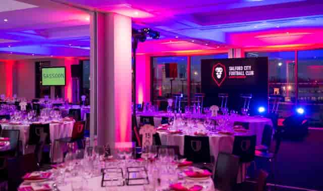Elegant event space at Hotel Football for gala or awards dinner, featuring vibrant decor.