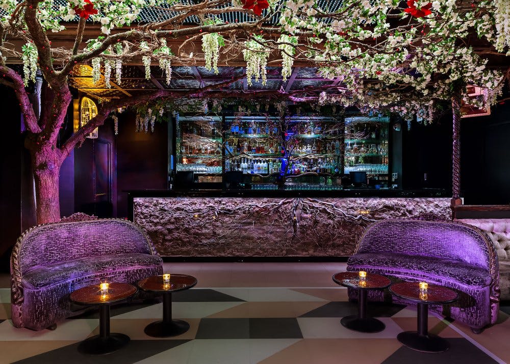 Stylish Cuckoo Club event space with floral bar, perfect for cocktail receptions.