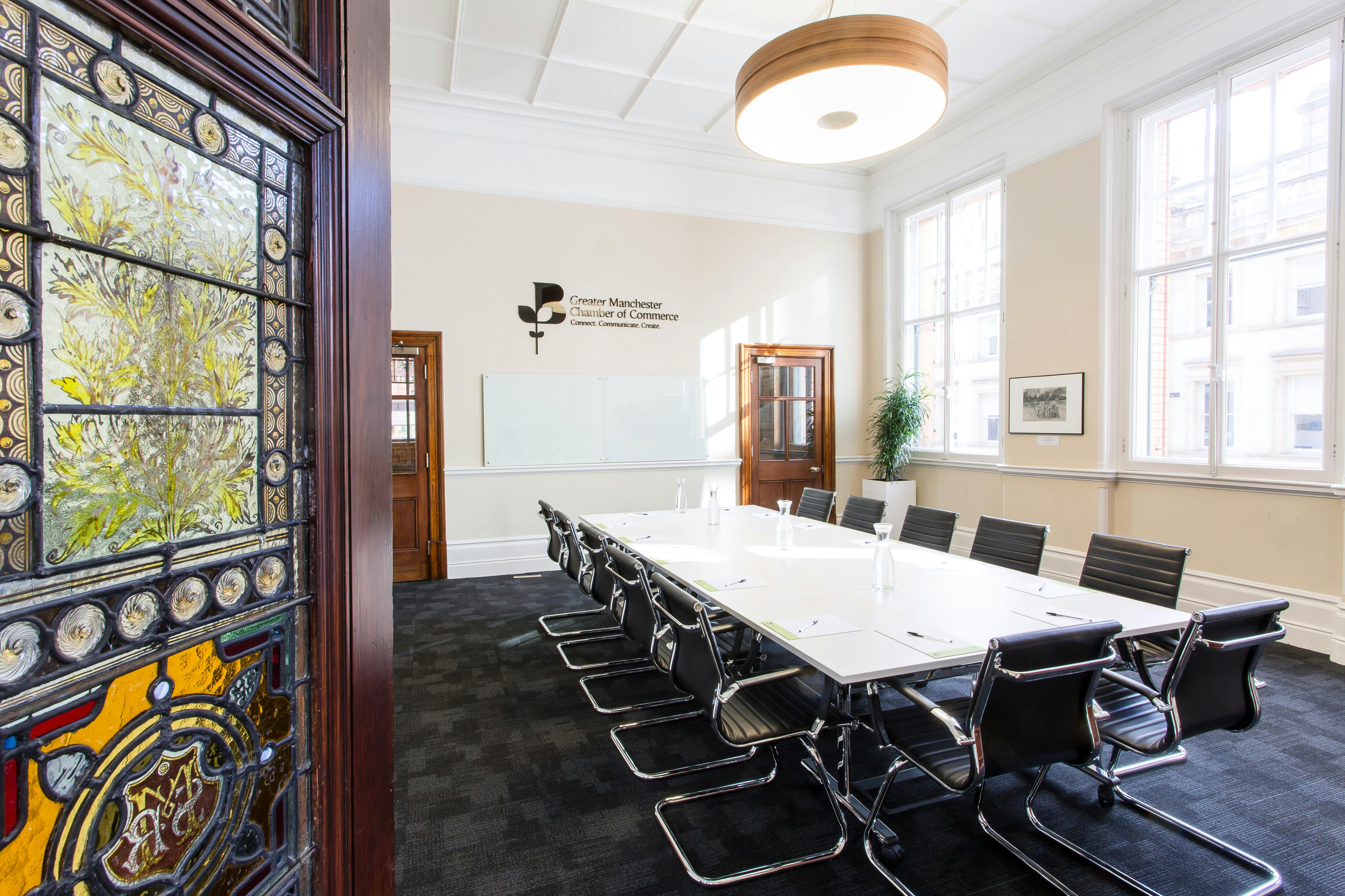 Connect Room in Chamber Space: modern meeting room with stained glass, perfect for workshops.