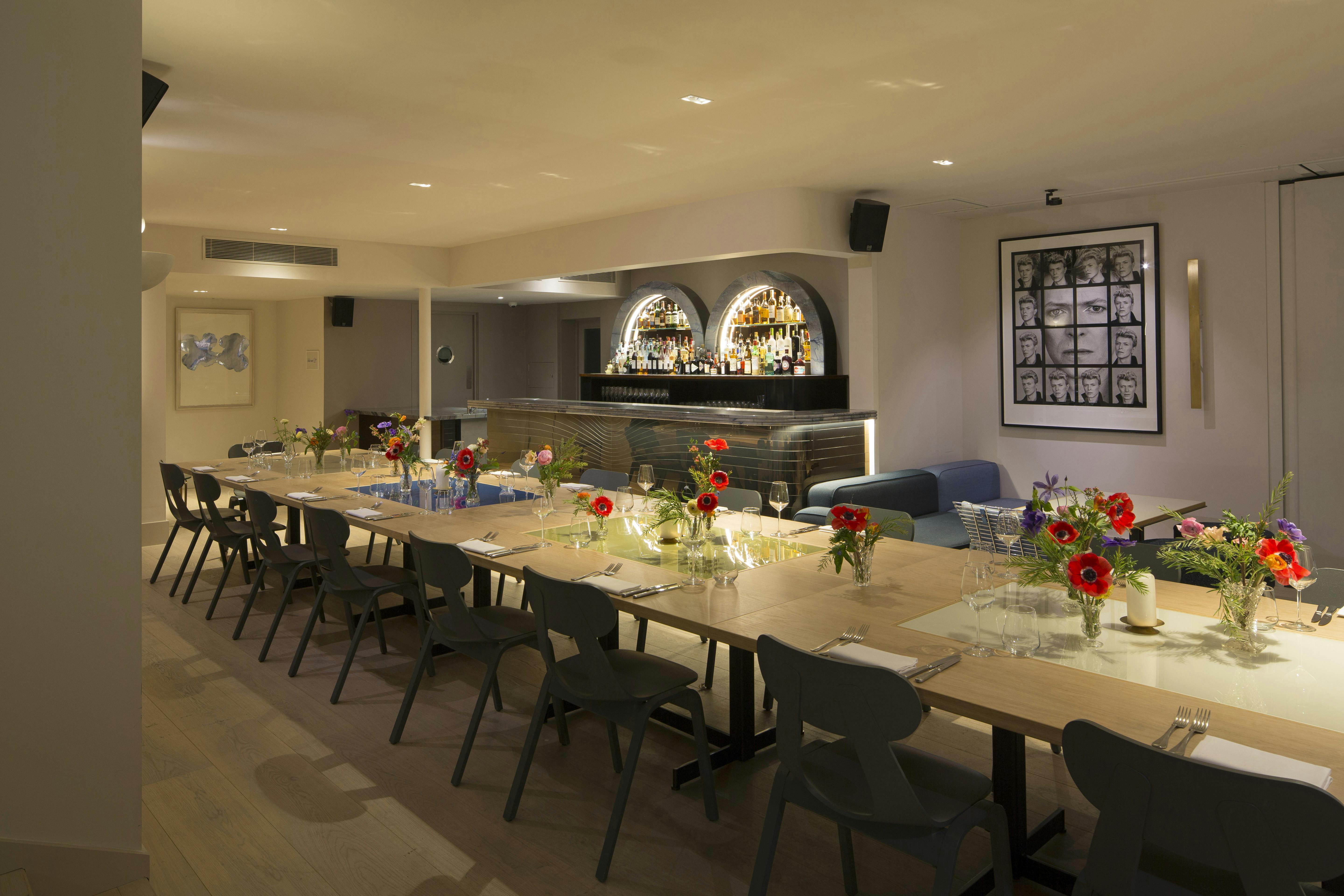 Gennaro Room at The Groucho Club: elegant event space with floral centerpieces for gatherings.