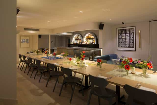Gennaro Room at The Groucho Club: elegant event space with floral centerpieces for gatherings.