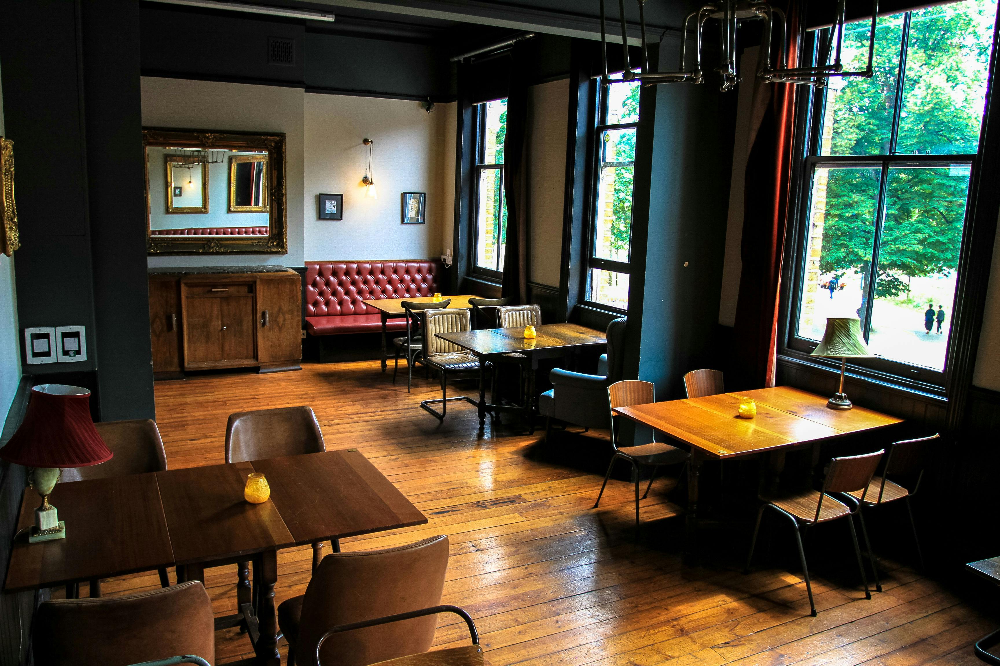 Stylish event space with wooden floors and vintage decor at The Snug, The Defector's Weld.