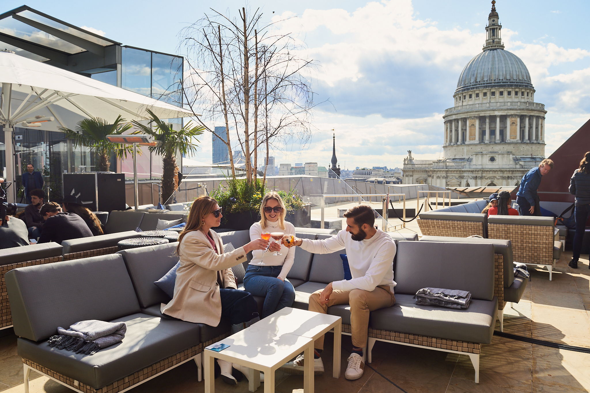 VIP Terrace rooftop venue with stylish seating and St. Paul's Cathedral backdrop for events.