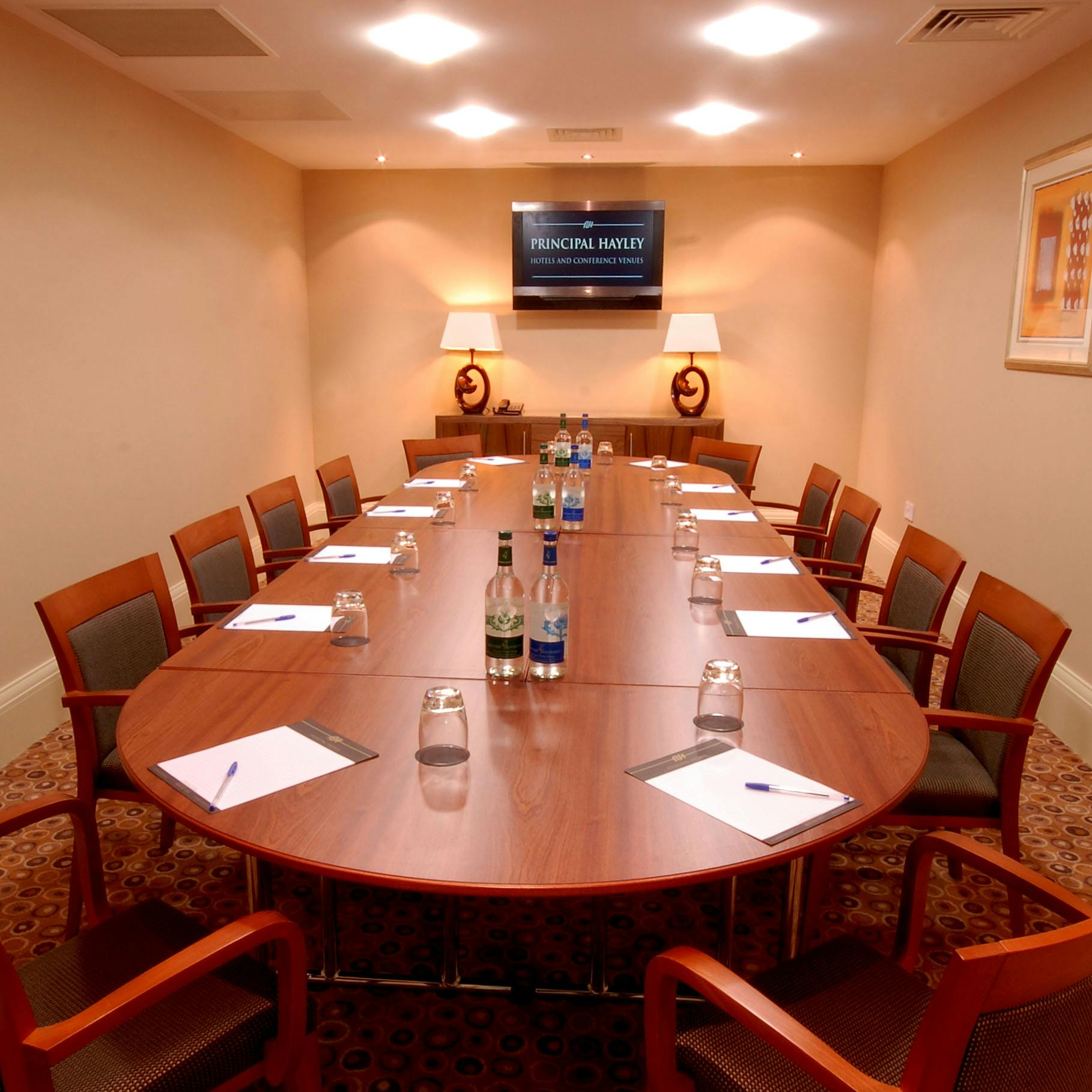 Met 18 meeting room at The Met Hotel, featuring an oval table for corporate events.