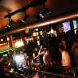 Vibrant networking venue in Suburb SW11 with warm lighting and spacious layout.