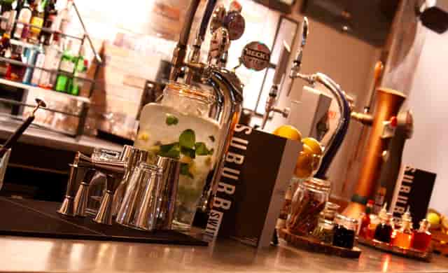 Whole Venue SW11 bar setup with sleek glassware for networking events and social gatherings.