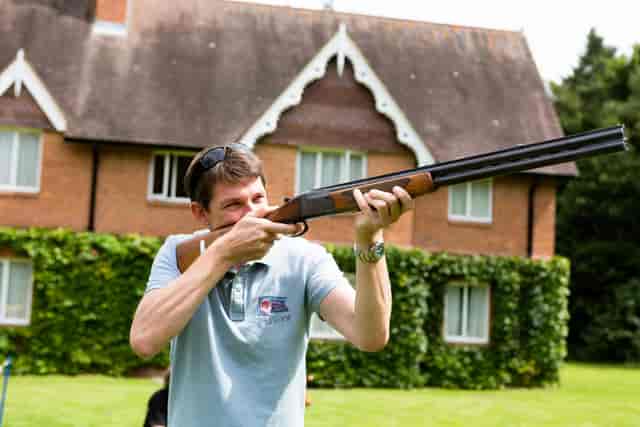 Participant shooting in Garden Pavilion, Audleys Wood Hotel for team-building event.