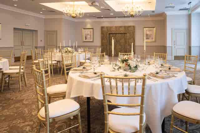 Usher Suite banquet setup with gold chairs for formal galas and corporate dinners.