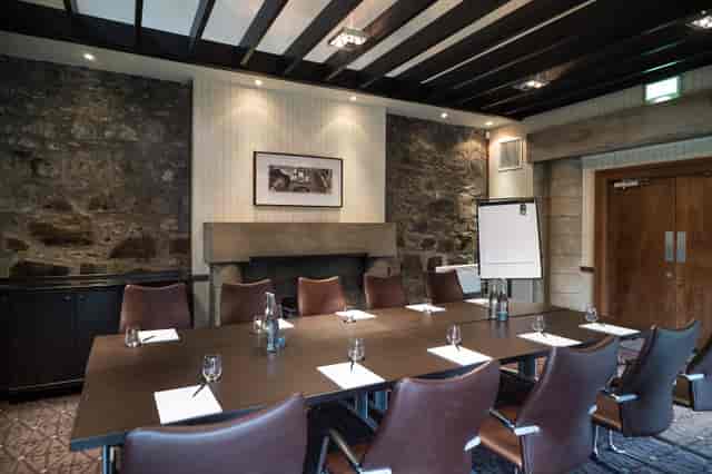 Boardroom meeting setup at Norton House Hotel, rustic stone walls, executive events, conferences.