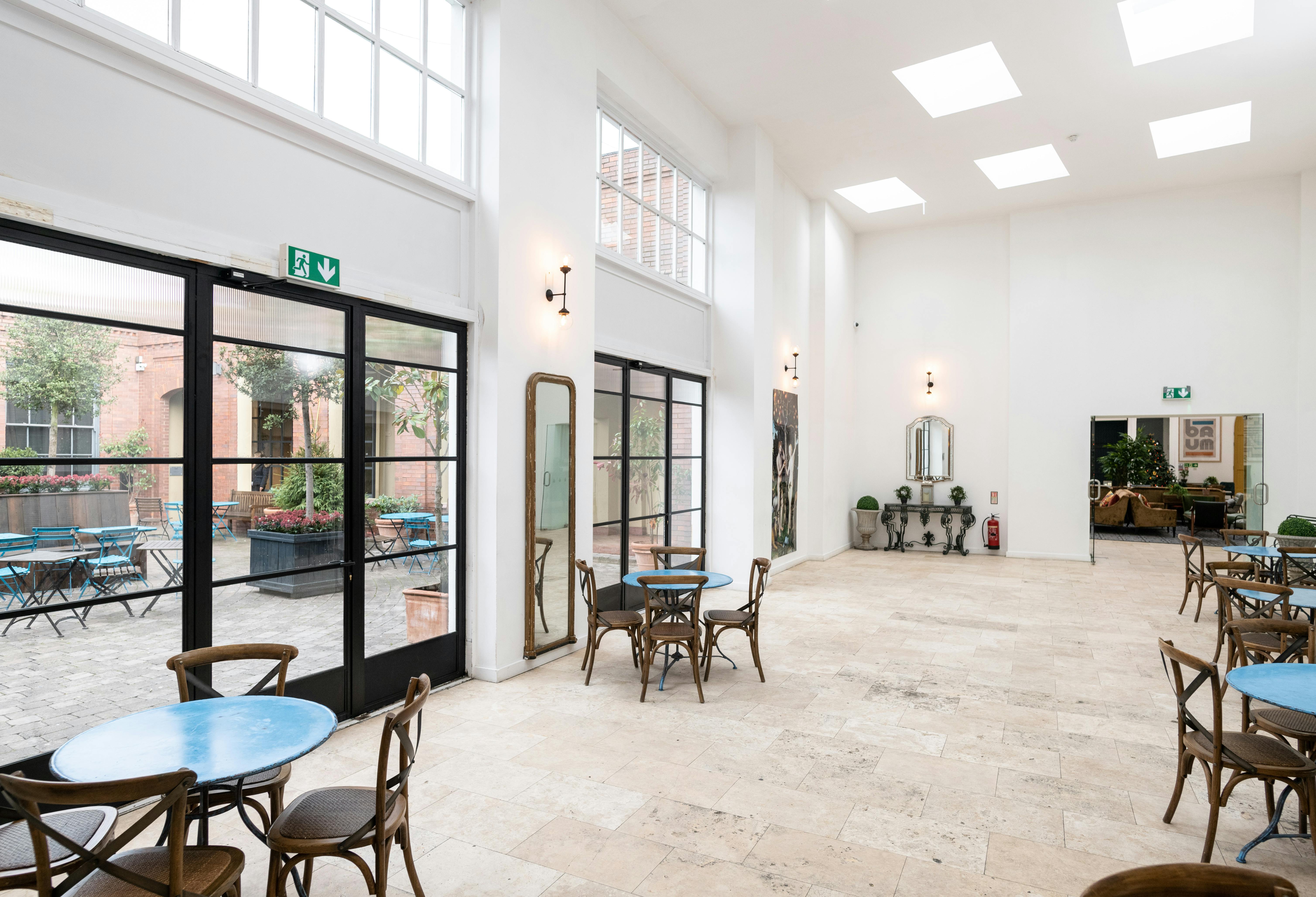 Bright event space at Fazeley Studios with large windows, ideal for gatherings and meetings.