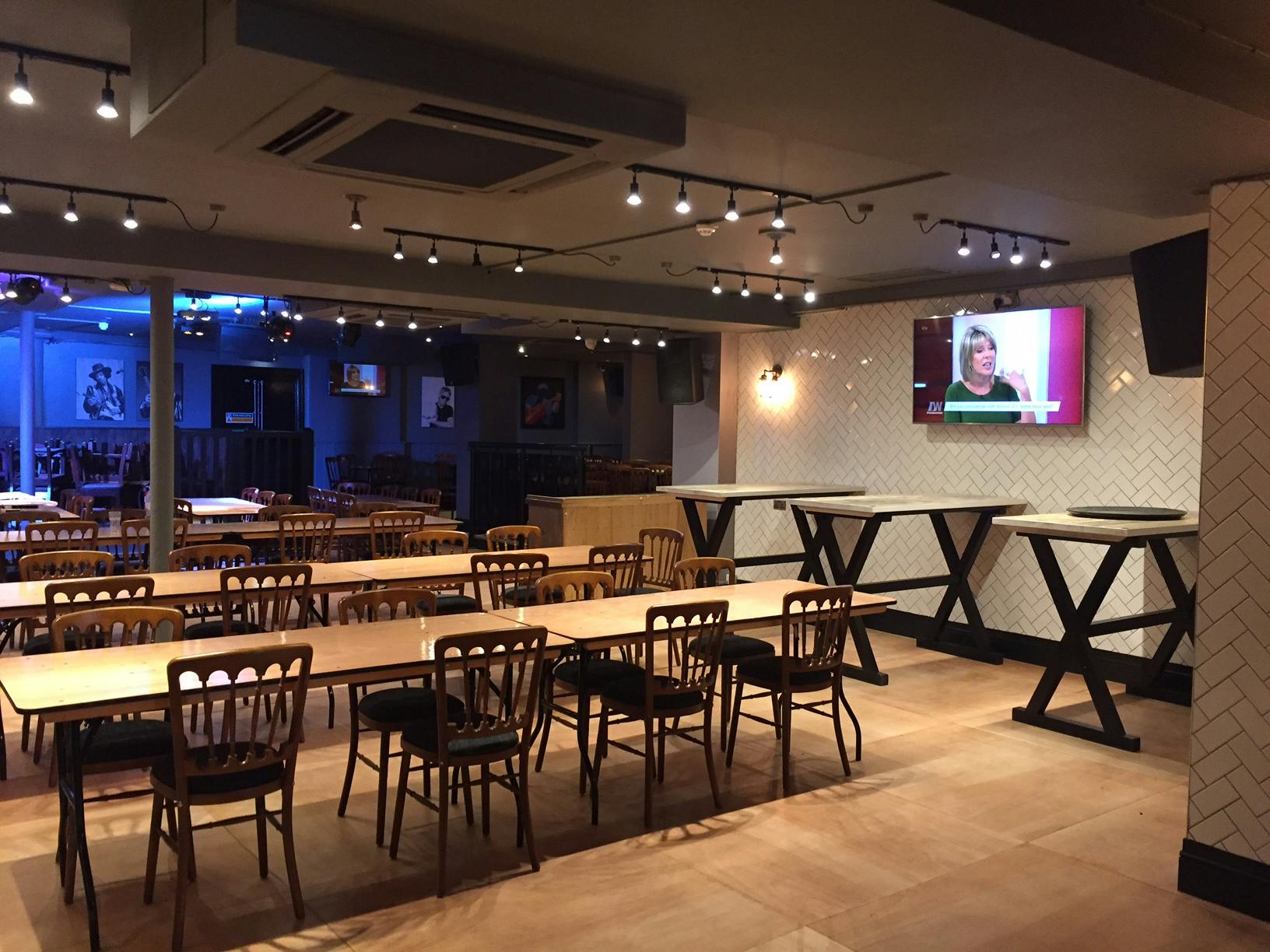 Versatile event space at O'Neill's Wardour Street, ideal for dining and presentations.