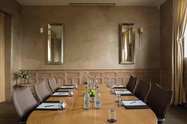 Saunders Room at Fawsley Hall: elegant meeting space for intimate gatherings and events.