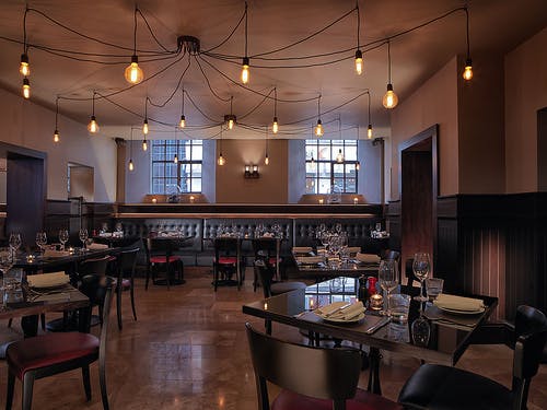 Chez Mal Brasserie in Leeds, stylish restaurant with warm lighting for events and gatherings.