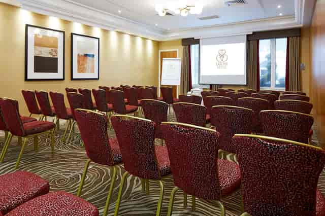 Edward Suite meeting room with upholstered chairs, ideal for corporate events and workshops.