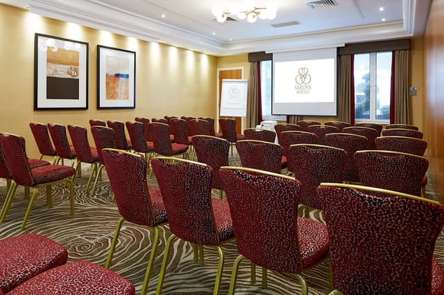Edward Suite meeting room with upholstered chairs, ideal for corporate events and workshops.