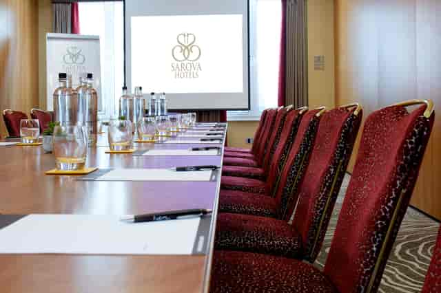Charles Suite meeting room at The Rembrandt, set for a corporate event with elegant decor.