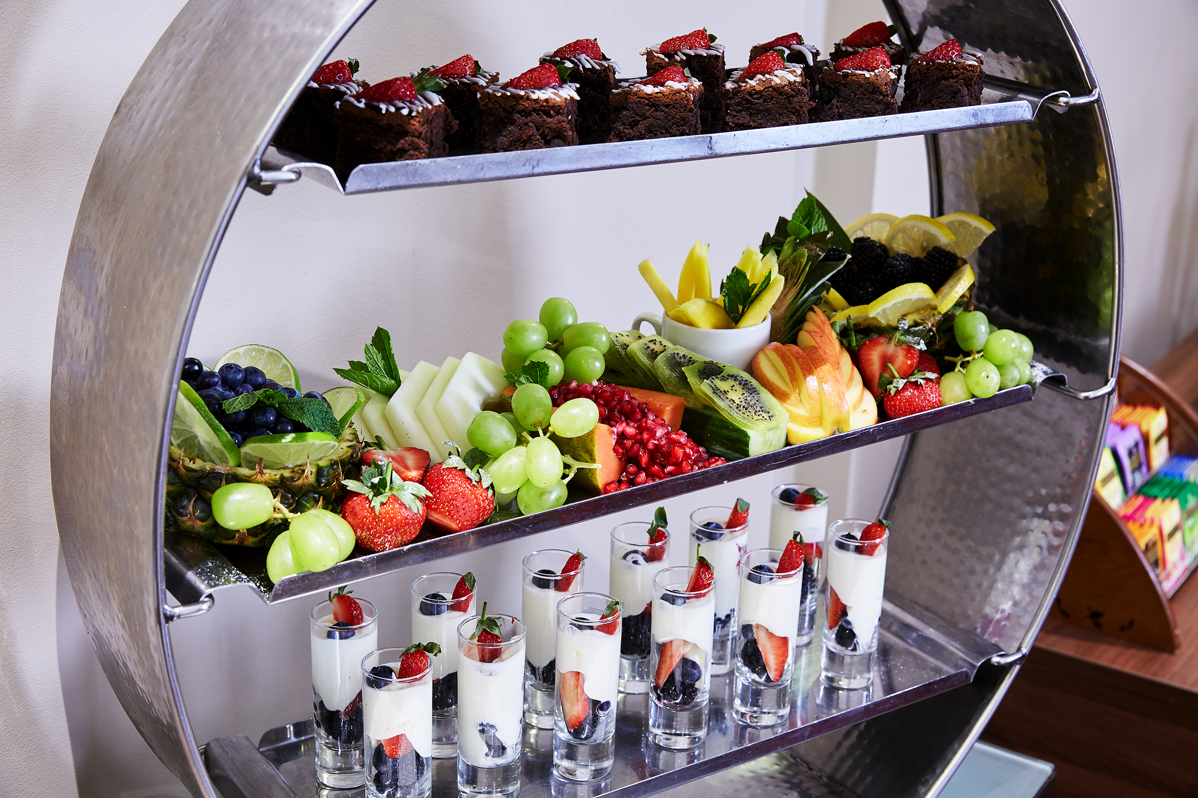 Dessert display with brownies and fruits for elegant event catering at The Rembrandt.