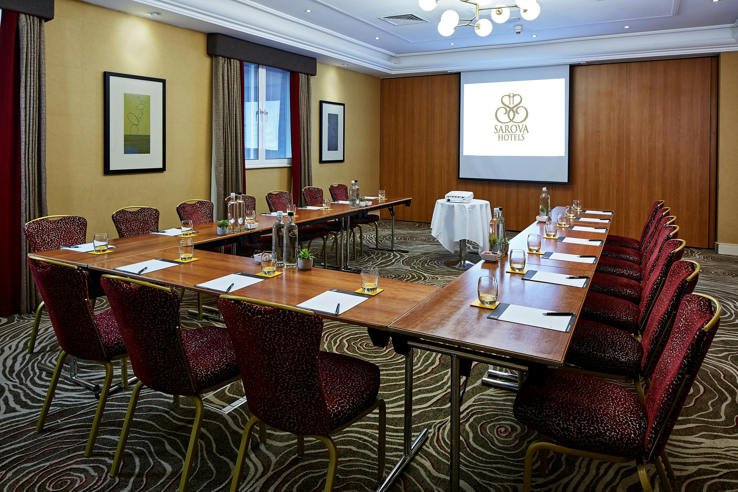 Elizabeth Suite meeting room with projector, ideal for corporate events and workshops.