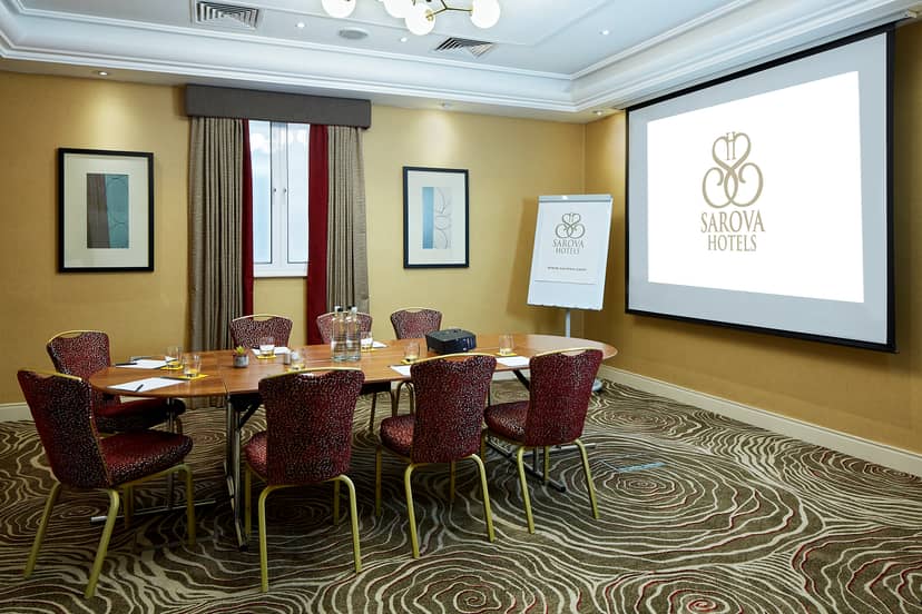 Victoria Suite meeting room with round table, ideal for corporate events and presentations.
