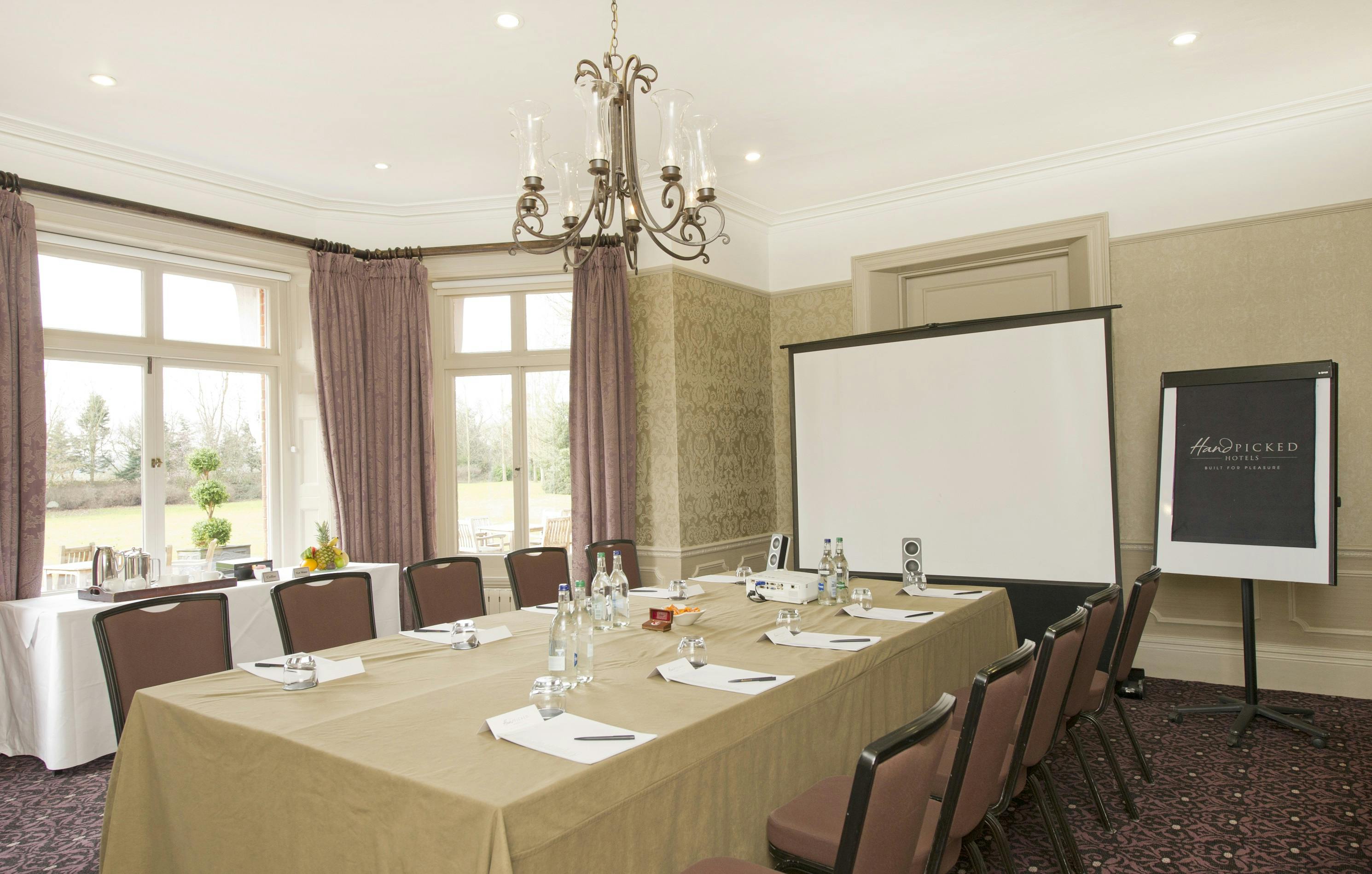 Meeting room at Woodlands Park Hotel with natural light for corporate events.