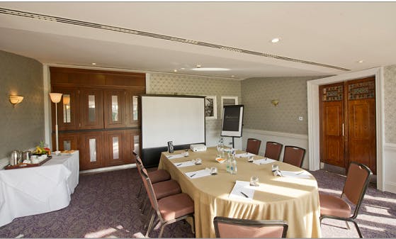 Chester Suite meeting room with round table, ideal for workshops and conferences.