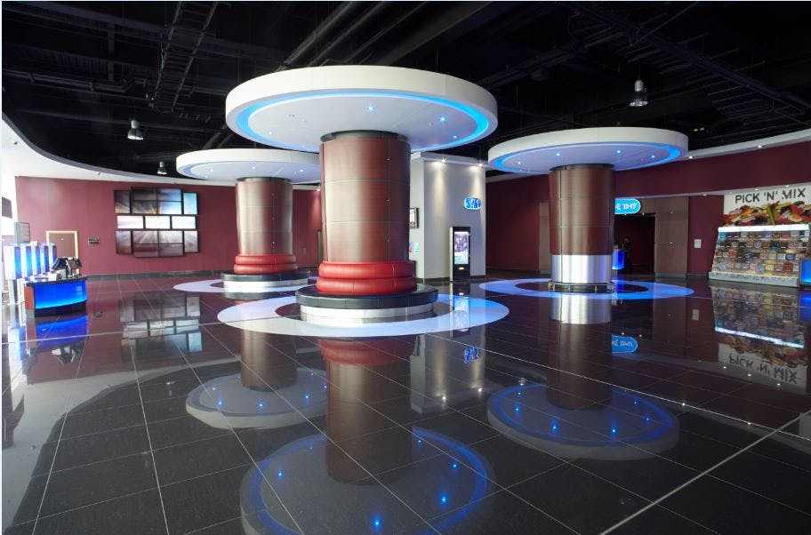 Modern event space with circular columns, ideal for networking and exhibitions.