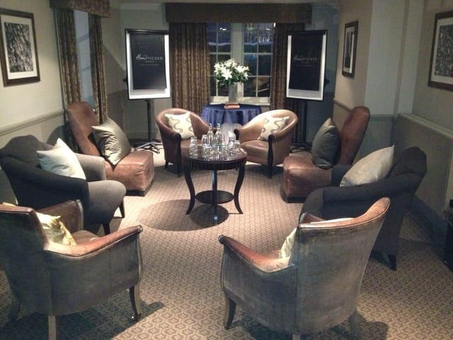 Cozy meeting space with plush armchairs at Wood Hall Hotel & Spa for brainstorming sessions.