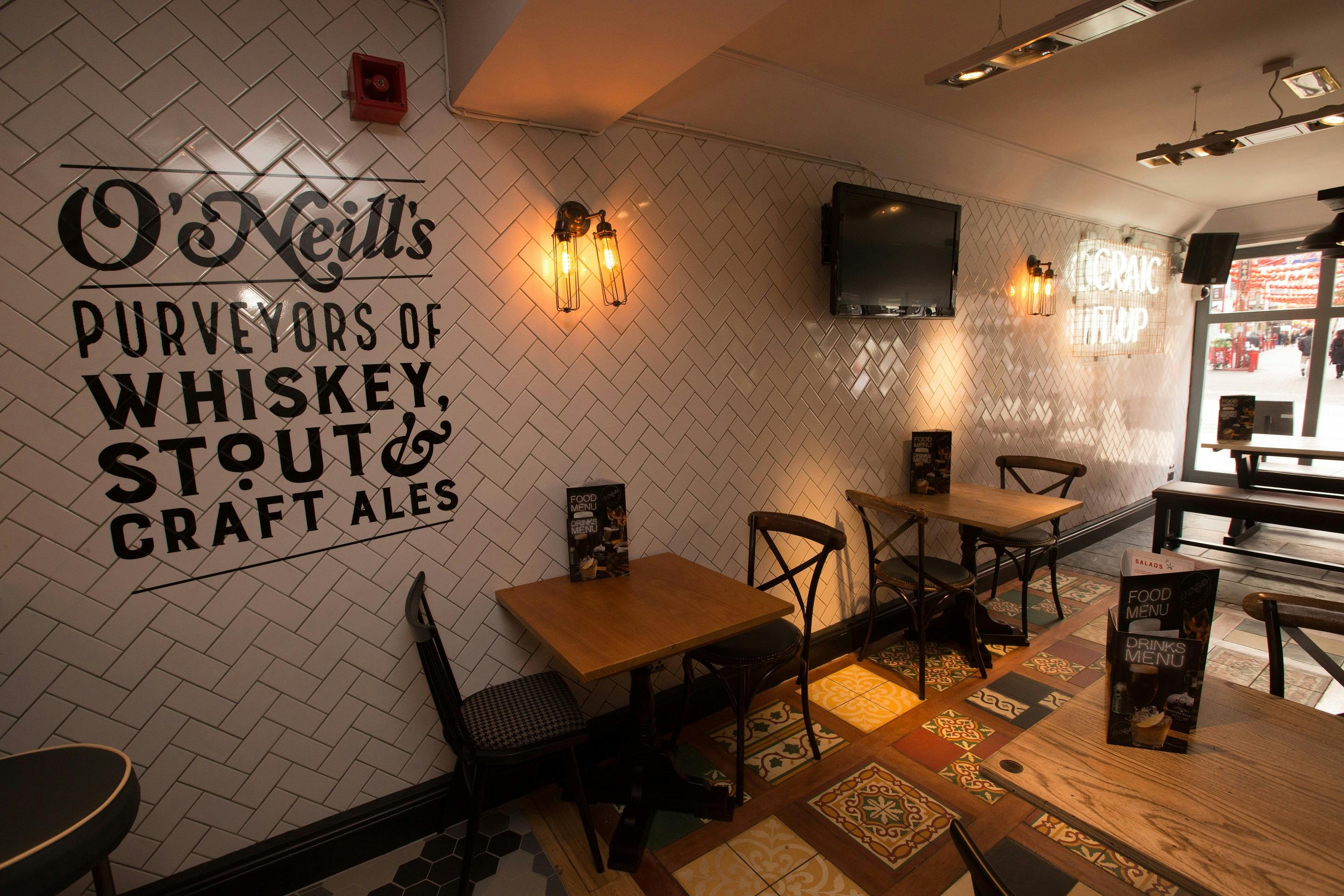 Cozy pub interior at O'Neill's Wardour Street, perfect for networking events and team-building.