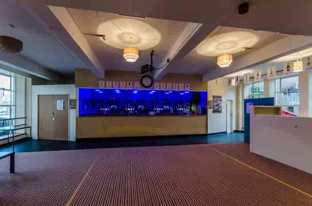 Modern bar area with blue lighting at Brierley Hill Civic Hall for versatile events.
