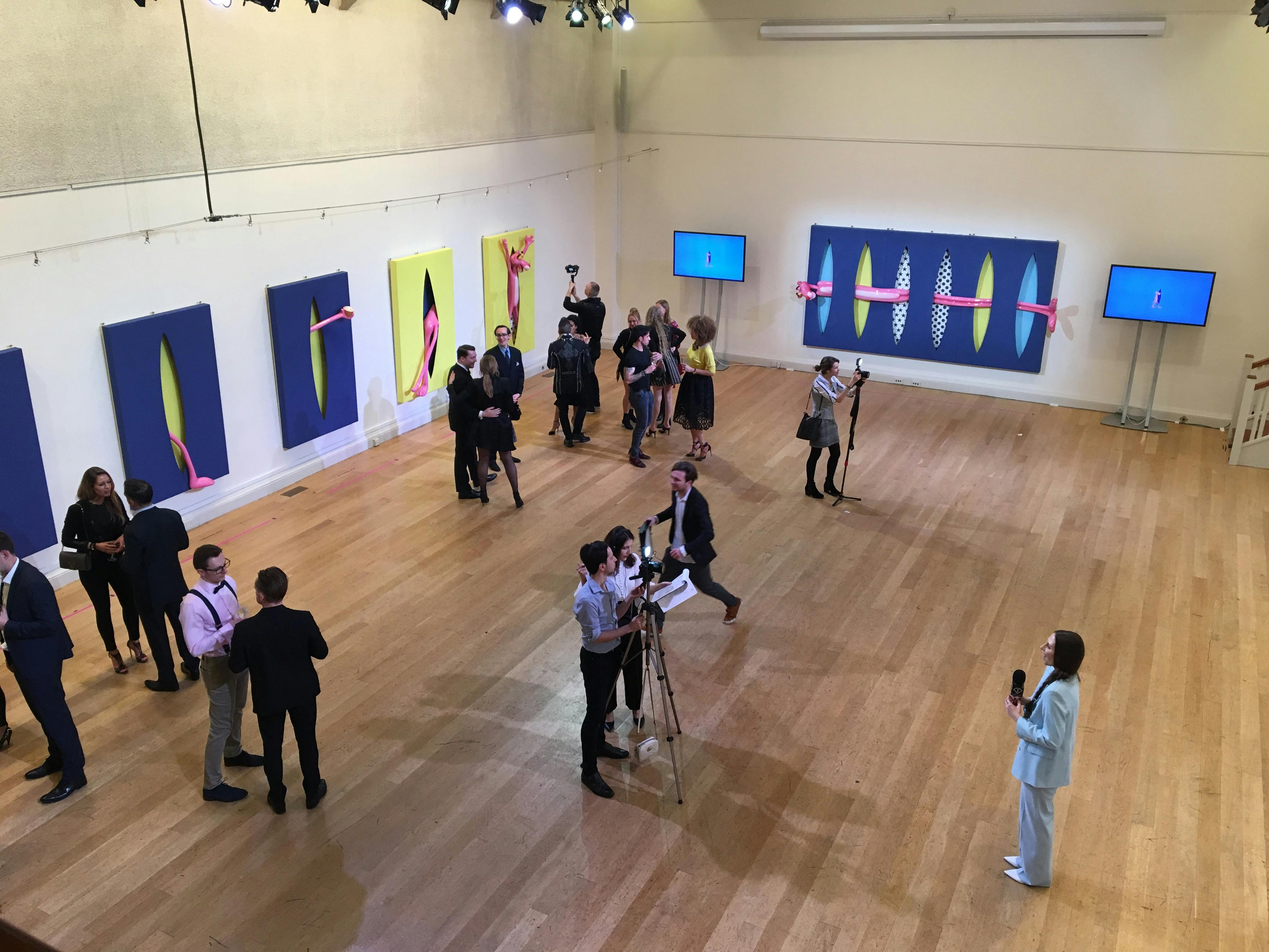 Great Hall at The Hellenic Centre, vibrant networking event with modern art.