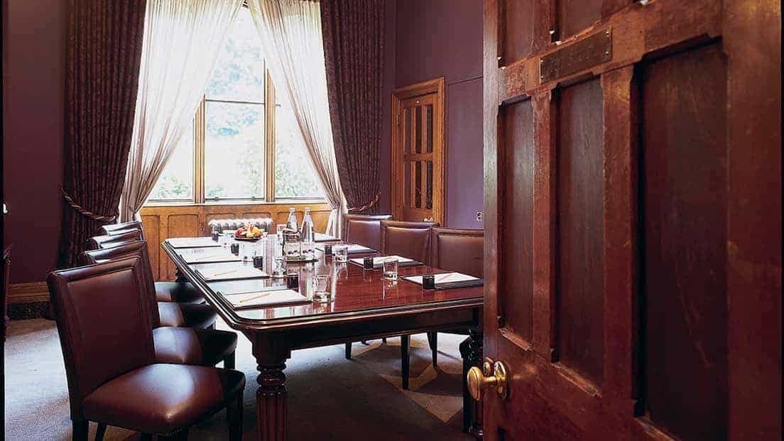 Elegant meeting room at Nutfield Priory, perfect for corporate events and discussions.